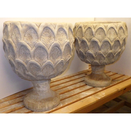 710 - A pair of pineapple shaped concrete garden urns, approx 48cm tall