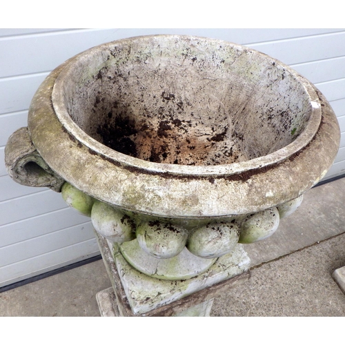 726 - A large concrete garden urn on stand, 117cm tall