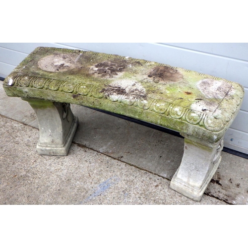 734 - A curved concrete garden bench