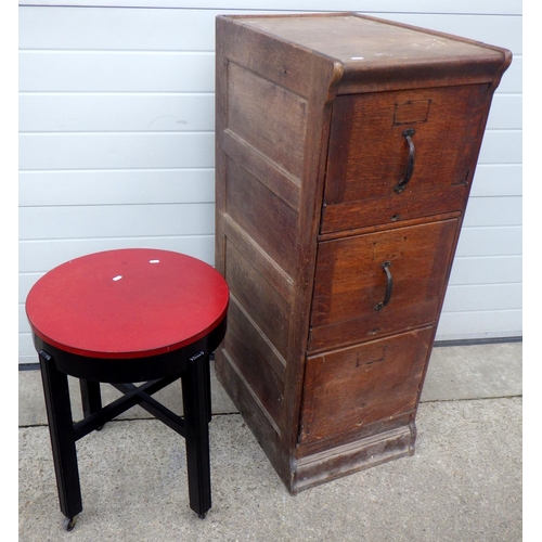749 - A 1930's oak three drawer filing cabinet together with a pub table (a/f)