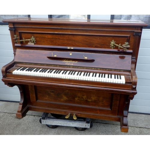 755 - A Bluthner rosewood cased upright piano, number 62273, with candle sconces, some damage, not all key... 
