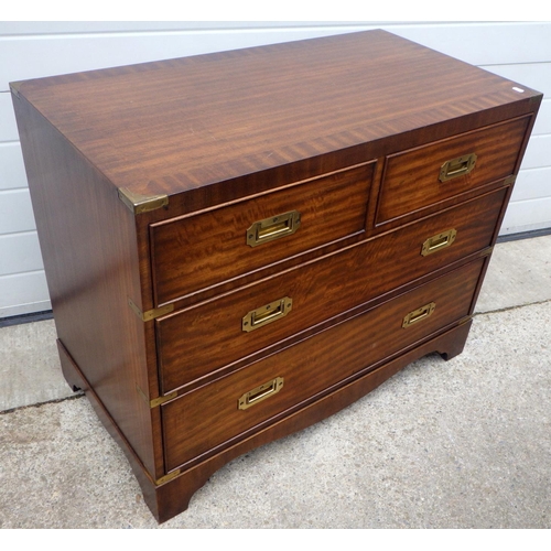 758 - A reproduction mahogany chest of drawers with campaign style brass inset handles and brass corners, ... 