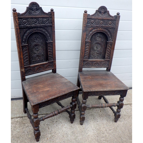 767 - A pair of panel back oak side chairs