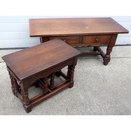 769 - An oak two drawer coffee table, 114cm wide together with a side loading oak nest of occasional table... 