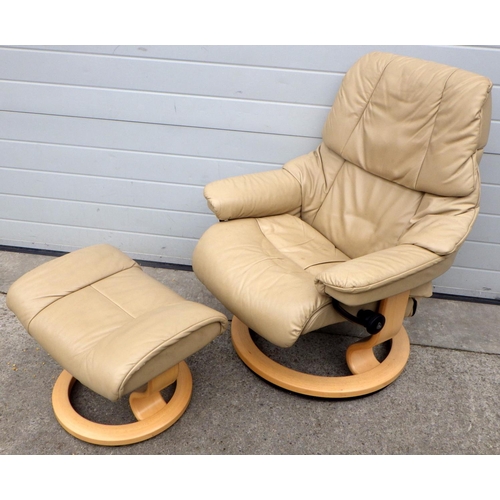 770 - A Stressless easy chair with footstool, wear