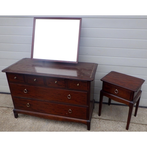 771 - A Stag Minstrel dressing chest together with a bedside table (2)