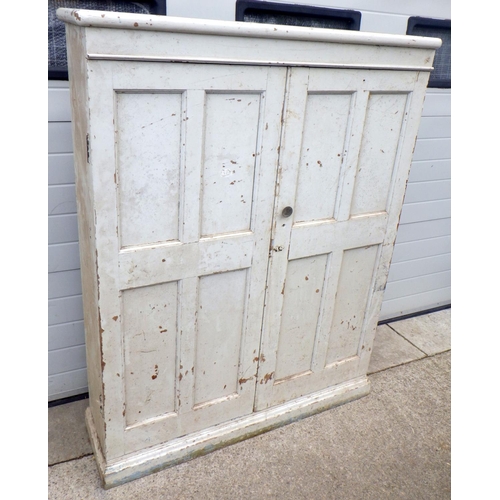 777 - A Victorian panelled pine school cupboard, later painted, 127cm wide
