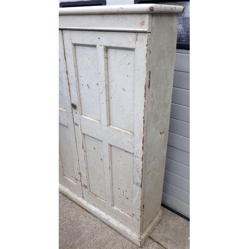 777 - A Victorian panelled pine school cupboard, later painted, 127cm wide