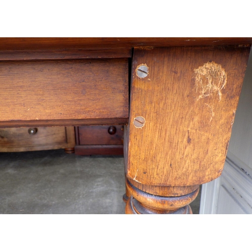 781 - A Victorian oak table on turned legs, missing central drawer, legs repaired (a/f) 190cm x 90cm, ex L... 