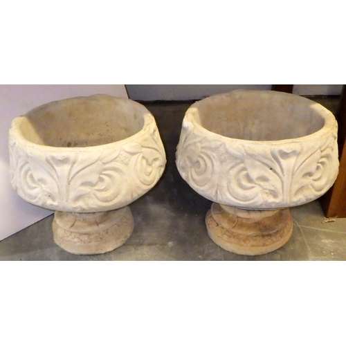 800 - A pair of concrete garden urns, 36cm tall