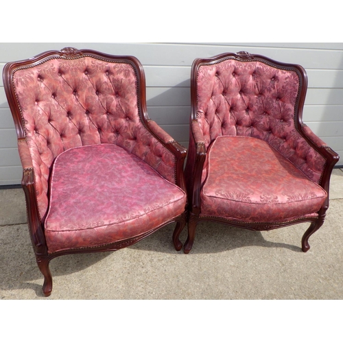 792 - A pair of button upholstered easy chairs