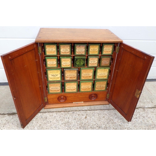 A Ferris & Co fitted Edwardian mahogany table top cabinet containing 18 Ferris & Co Ever Ready Caddies for surgical dressings, Lint, Gauze etc, 49cm wide, one tin caddy missing the end detail card
