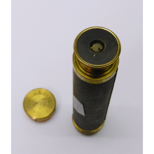 328 - A gilt brass and leather three draw pocket telescope.  150mm closed.