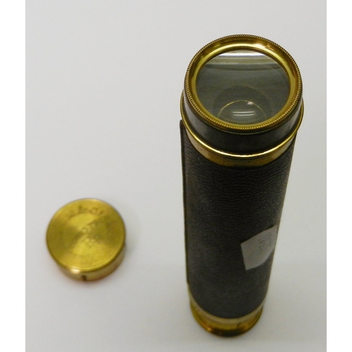 328 - A gilt brass and leather three draw pocket telescope.  150mm closed.