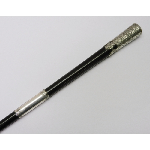 335 - An Edwardian conductor's baton, silver banded ebony.  523mm long