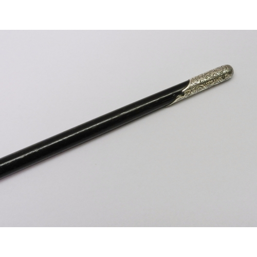 335 - An Edwardian conductor's baton, silver banded ebony.  523mm long