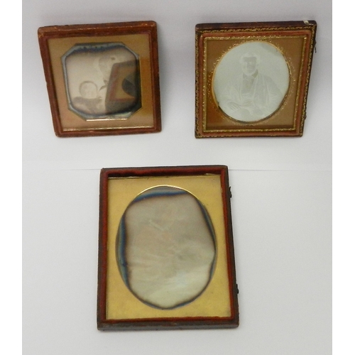 338 - Victorian photography: three daguerreotype portraits / portrait groups each presented in a part case... 