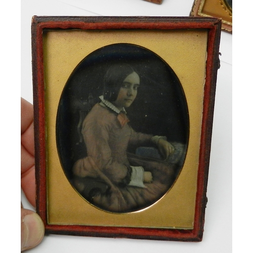 338 - Victorian photography: three daguerreotype portraits / portrait groups each presented in a part case... 