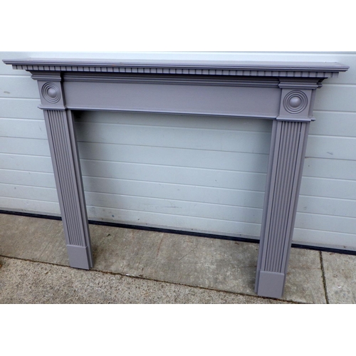 820 - A grey painted fire surround, 138cm wide