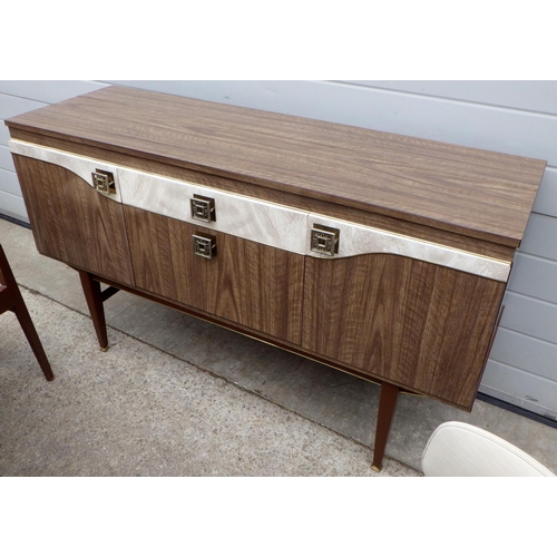 828 - A 1960's, brown formica dining suite incl drop leaf table, sideboard and four chair frames, seats sp... 