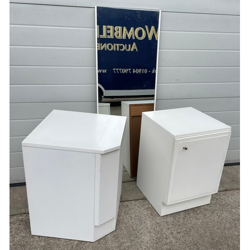 829 - A white Stag cupboard together with a further chipboard cupboard and a mirror (3)