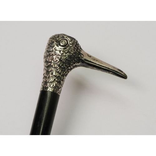 299 - An Edwardian ebony walking cane, the imported silver modelled as a bird's head.  A/F end cut, curren... 