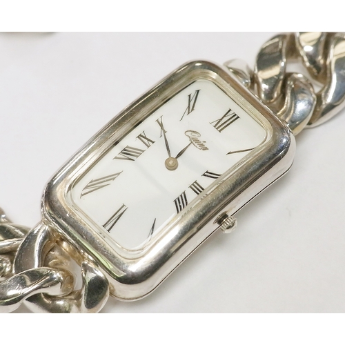 114 - A Quinn bracelet watch comprising a quartz movement beneath an enamel dial in a rectangular tonneau ... 