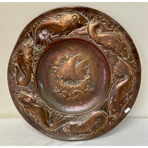 A large Arts & Crafts unsigned Newlyn style copper charger