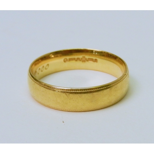 70 - A 9ct gold band ring, bearing presentation engraving to inner face.  7g.