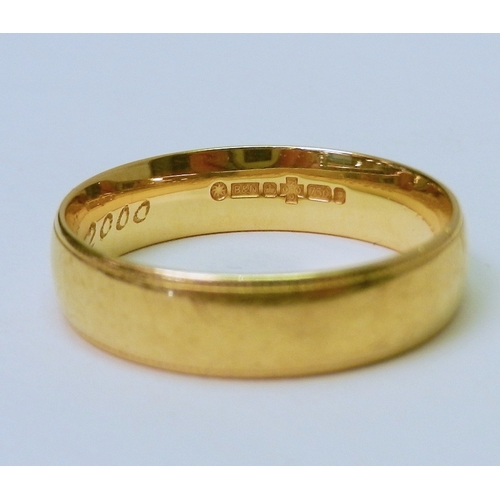 70 - A 9ct gold band ring, bearing presentation engraving to inner face.  7g.