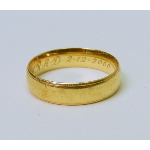 70 - A 9ct gold band ring, bearing presentation engraving to inner face.  7g.