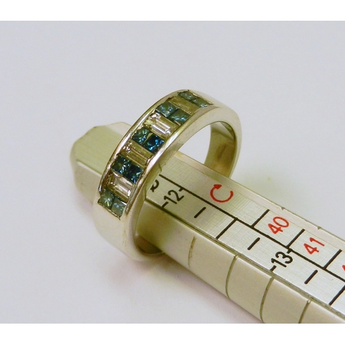 An eternity-style ring comprising fourteen channel set stones being four rectangle cut diamonds and ten square cut sapphires in a white metal setting marked 14k.  Diamonds approximately 3.75mm long x 2.25mm wide / head approximately 5.75mm wide.