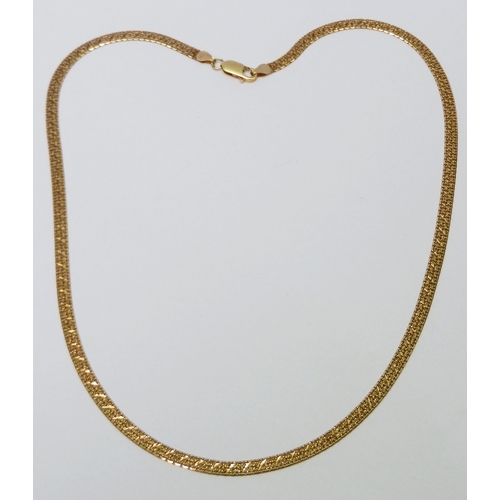 74 - A ribbon necklace, 9ct gold.  520mm long / 10g.