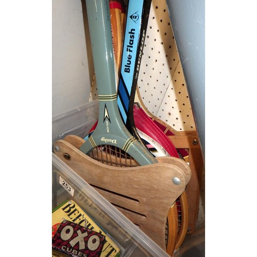 253 - A group of vintage tennis rackets together with advertising tins