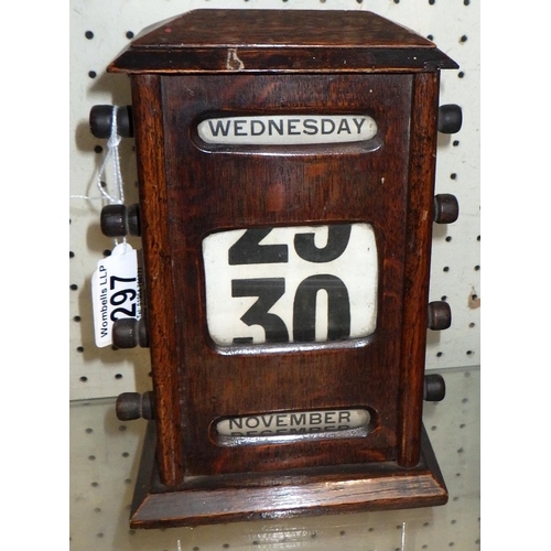 297 - An Edwardian oak desk top calendar