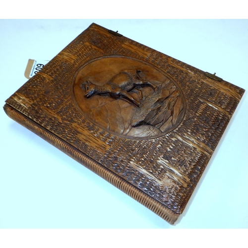 309 - A carved Deer Black Forest postcard album & postcards