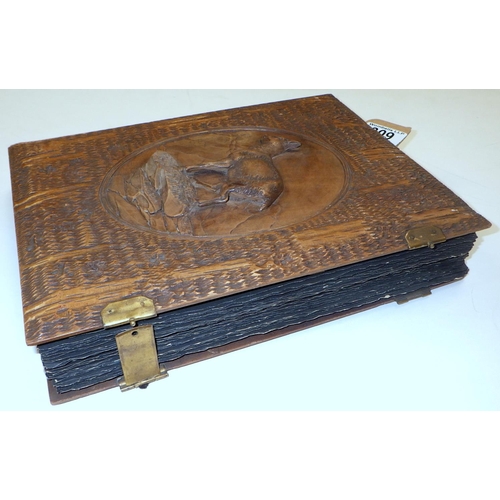 309 - A carved Deer Black Forest postcard album & postcards