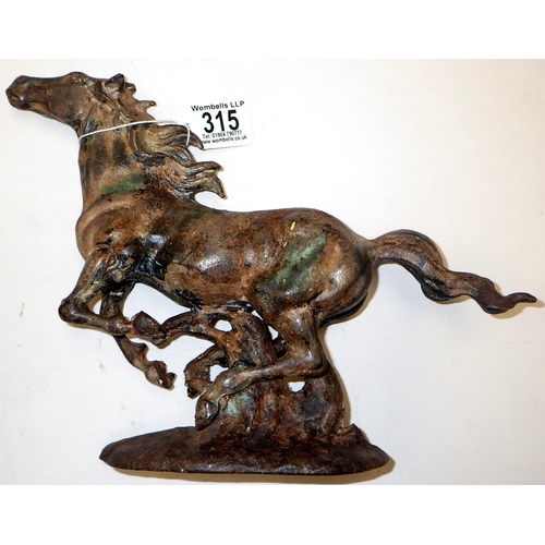 315 - A cast metal figure of a running horse 22cm high