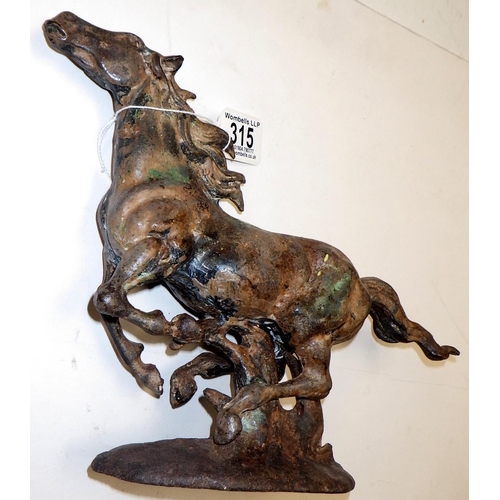 315 - A cast metal figure of a running horse 22cm high