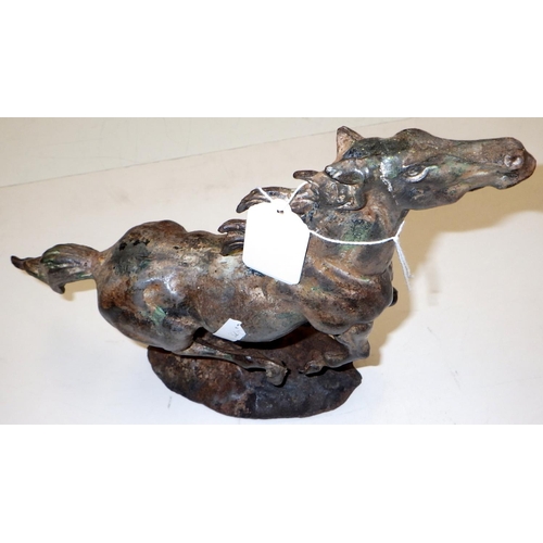 315 - A cast metal figure of a running horse 22cm high