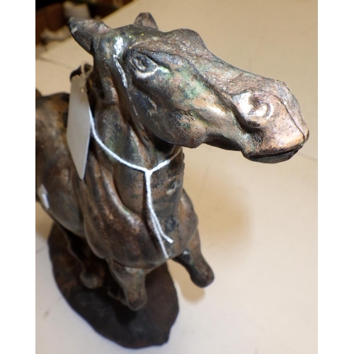 315 - A cast metal figure of a running horse 22cm high