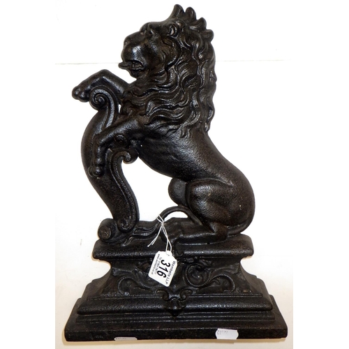 316 - A 19thC cast iron rampant lion door stop 37cm high