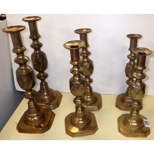 398 - Three pairs of brass candlesticks