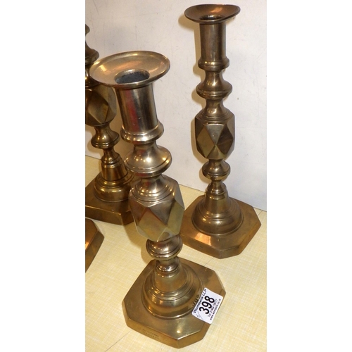 398 - Three pairs of brass candlesticks