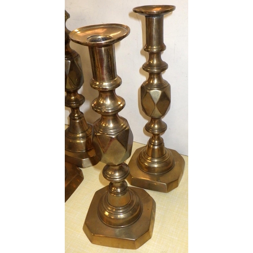 398 - Three pairs of brass candlesticks