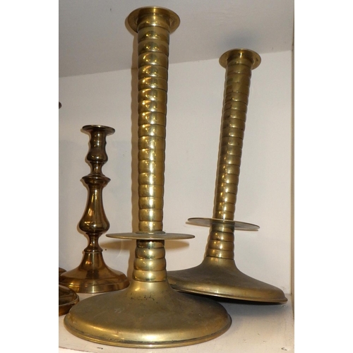 418 - Four pairs of brass candlesticks