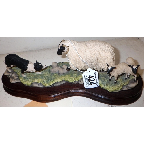 424 - A Border Fine Arts dog with sheep with certificate