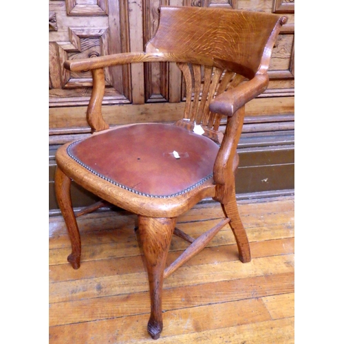 703 - A 1930's oak office chair with upholstered seat on cabriole legs, ex Bootham Park Hospital