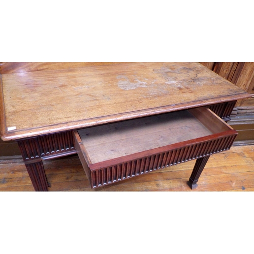 721 - A mahogany side table with fluted frieze and legs, faded top, 125cm wide, ex Bootham Park Hospital