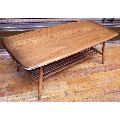 741 - A rounded rectangular Ercol coffee table with lower spindle shelf, 105cm long, ex Bootham Park Hospi... 